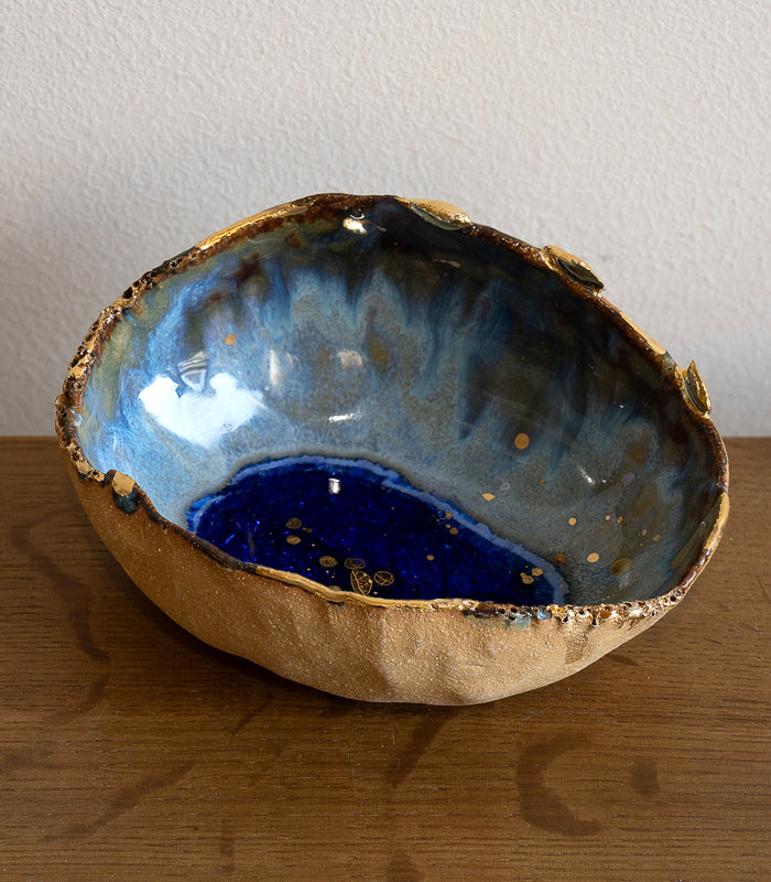 Azure Ring Dish by G-007, gold and blue resin ring dish with textured wave-like inner tray.